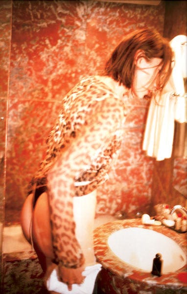 Reine in the Leopard Dress in the Bathroom, L'Hotel, Paris
